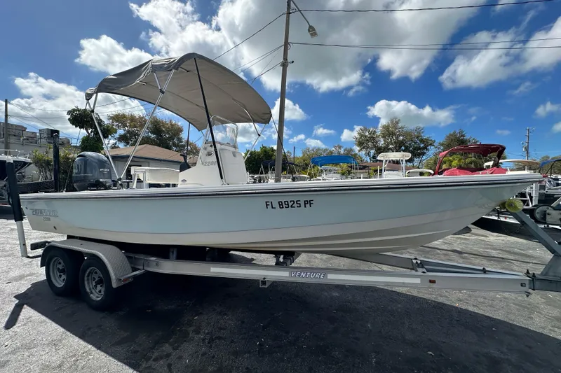 Slide: The Image of 2012 Pathfinder 2200 V boat on trailer under blue sky. - 9