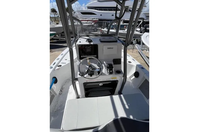 Slide: The Image of 2026 Sea Pro 210 Bay boat console with steering wheel and navigation equipment. - 5