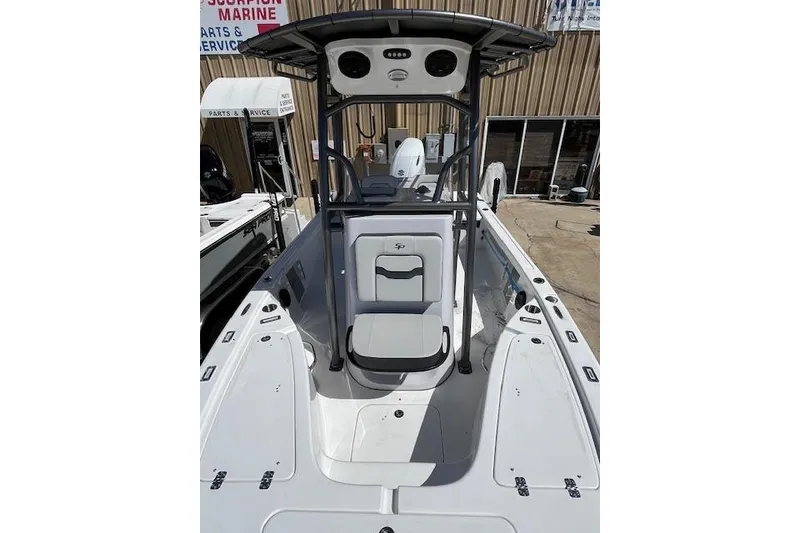 Slide: The Image of 2026 Sea Pro 210 Bay boat interior with center console and seating. - 9