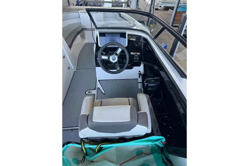 Slide: The Image of 2024 Yamaha Boats AR250 cockpit with steering wheel and seating. - 4