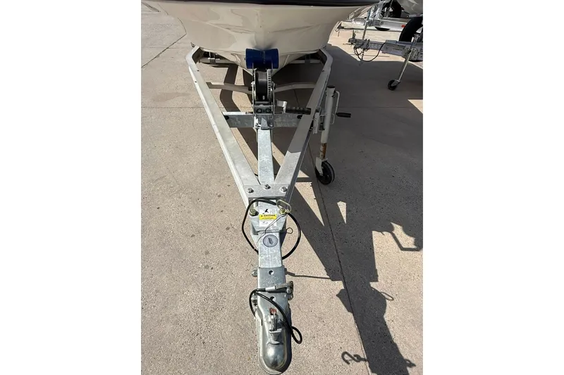 Slide: The Image of 2024 Mako 18 LTS boat trailer hitch on concrete surface. - 14