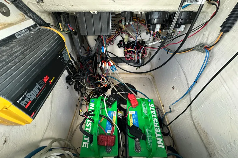 Slide: The Image of Electrical system of a 2012 Pathfinder 2200 TRS boat with batteries and wiring. - 13