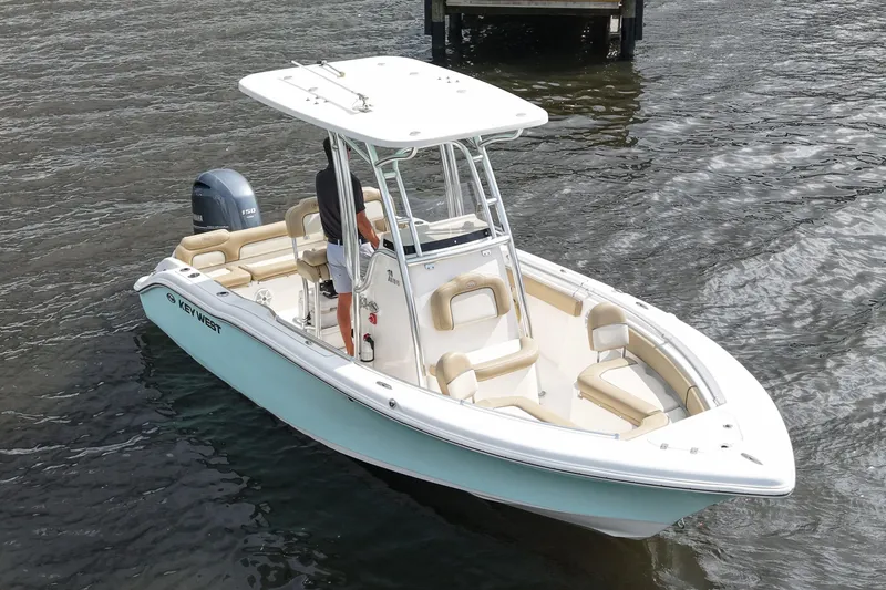 Slide: The Image of 2018 Key West 219 FS boat on water, featuring sleek design and spacious seating. - 15