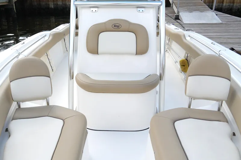 Slide: The Image of 2018 Key West 219 FS boat interior with beige and white seating. - 23
