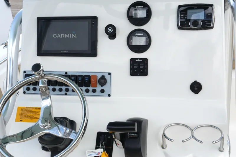 Slide: The Image of Control panel of 2018 Key West 219 FS boat with Garmin display and Yamaha gauges. - 25