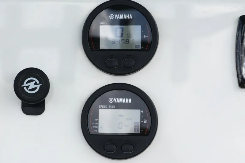 Slide: The Image of Yamaha gauges on 2018 Key West 219 FS boat dashboard, displaying tachometer and speed fuel readings. - 28