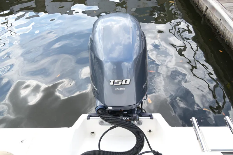 Slide: The Image of 2018 Key West 219 FS boat with Yamaha 150 outboard motor on water. - 34