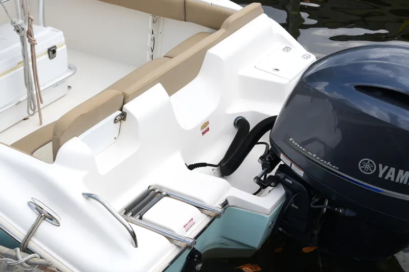 Slide: The Image of 2018 Key West 219 FS boat with Yamaha outboard motor and cushioned seating. - 35