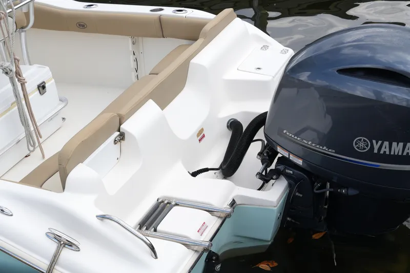 Slide: The Image of 2018 Key West 219 FS boat with Yamaha outboard motor and beige seating. - 36