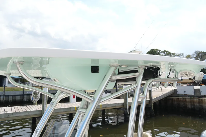 Slide: The Image of 2018 Key West 219 FS boat with sleek metal framework at dockside. - 38