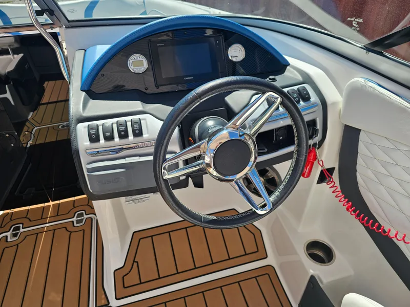 Slide: The Image of 2019 Regal 23 OBX boat helm with modern dashboard design. - 11