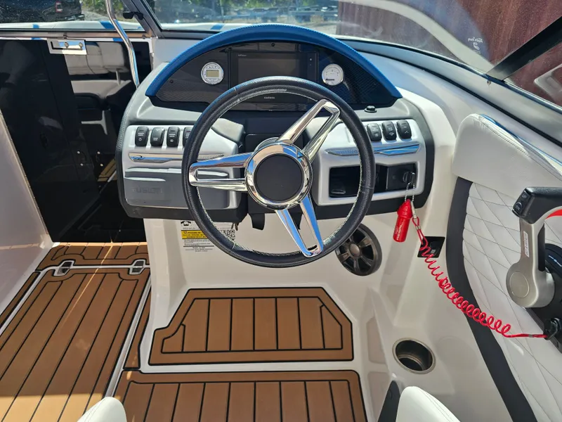 Slide: The Image of Interior of a 2019 Regal 23 OBX boat with modern dashboard. - 12