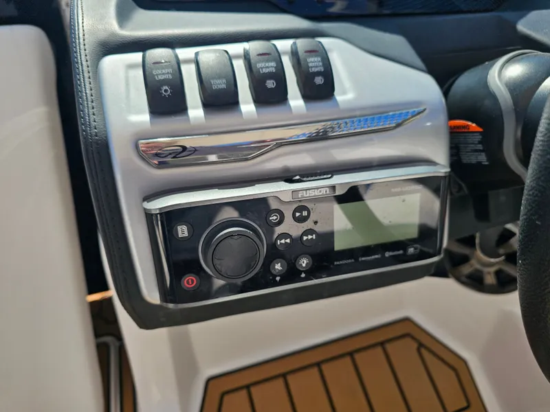 Slide: The Image of Regal 23 OBX 2019 boat console with Fusion audio system. - 23
