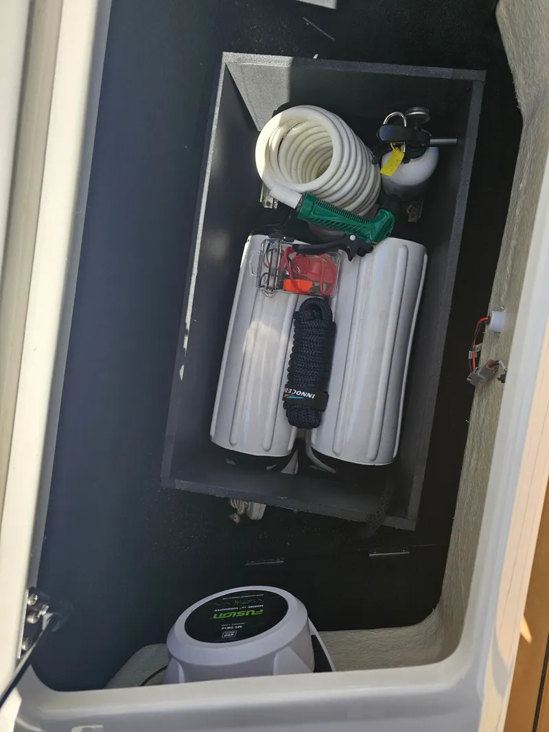 Slide: The Image of Regal 23 OBX 2019 boat storage compartment with accessories. - 25