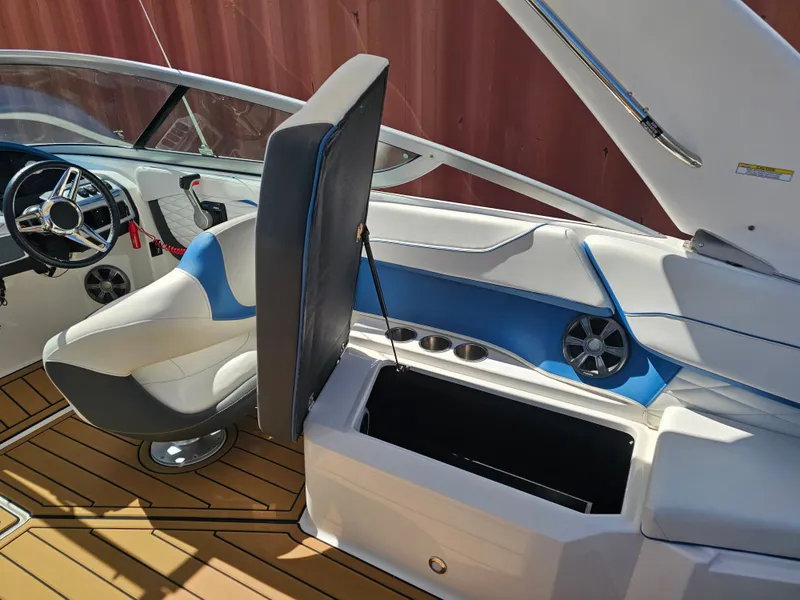 Slide: The Image of Interior of a 2019 Regal 23 OBX boat with seating and storage. - 26
