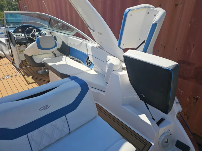 Slide: The Image of Interior of a 2019 Regal 23 OBX boat with blue accents. - 41