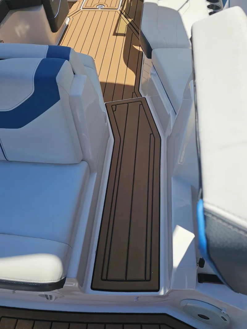 Slide: The Image of Interior of a 2019 Regal 23 OBX boat with wooden flooring. - 42