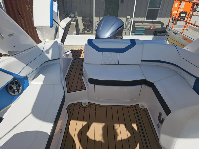 Slide: The Image of Interior of a 2019 Regal 23 OBX boat with white and blue seating. - 43