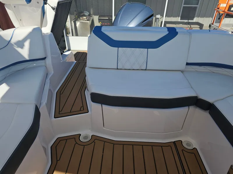 Slide: The Image of Interior of a 2019 Regal 23 OBX boat with white and blue seating. - 44