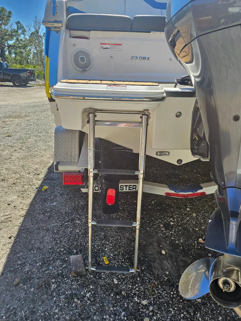 Slide: The Image of Regal 23 OBX 2019 with extended swim ladder. - 47