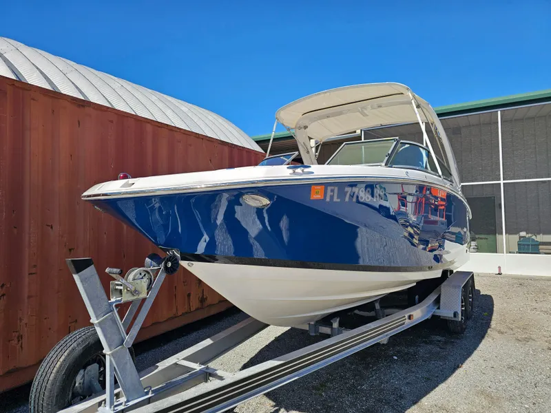 Slide: The Image of 2019 Regal 23 OBX boat on trailer in front of warehouse. - 48