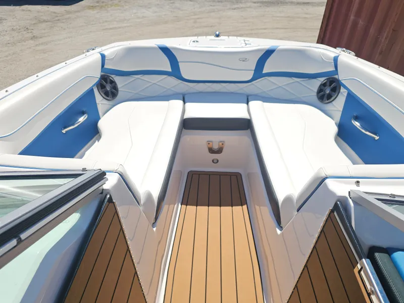 Slide: The Image of Interior of a 2019 Regal 23 OBX boat with blue and white seating. - 7