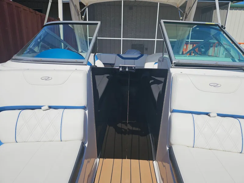 Slide: The Image of Interior view of a 2019 Regal 23 OBX boat with white seating. - 9