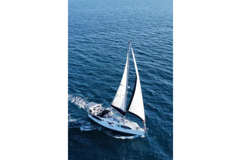 The Image of Sailing yacht Beneteau Oceanis 461, 1997 model, cruising on open blue sea. - 0