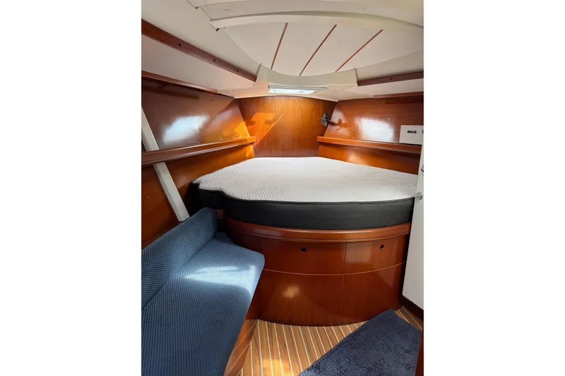 Slide: The Image of Cozy cabin interior of 1997 Beneteau Oceanis 461 sailboat with wooden finish and comfortable bed. - 10