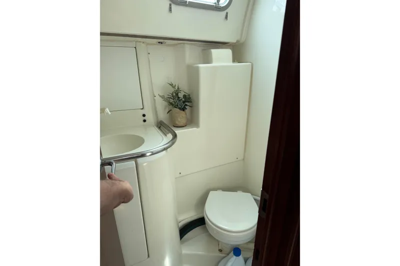 Slide: The Image of Bathroom interior of 1997 Beneteau Oceanis 461 yacht, featuring sink and toilet. - 13