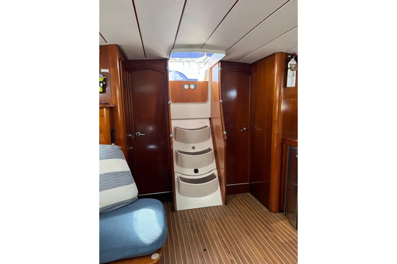 Slide: The Image of Interior of 1997 Beneteau Oceanis 461 sailboat with wooden finish and staircase. - 15