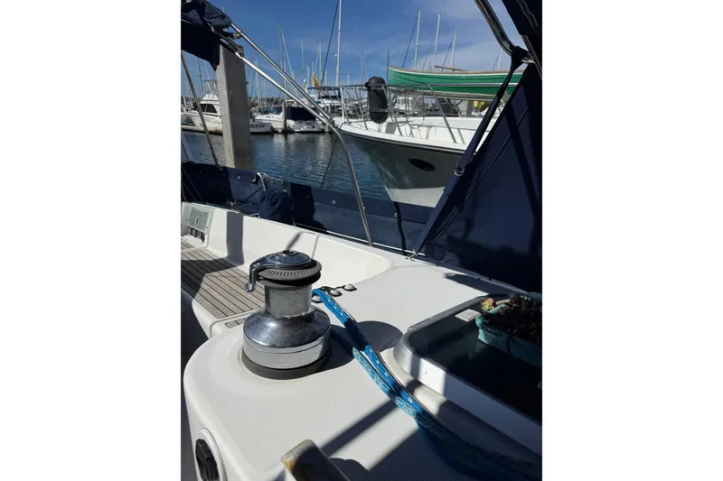 Slide: The Image of 1997 Beneteau Oceanis 461 sailboat deck with winch, docked in marina. - 16