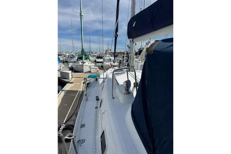 Slide: The Image of 1997 Beneteau Oceanis 461 sailboat docked at marina under clear sky. - 17