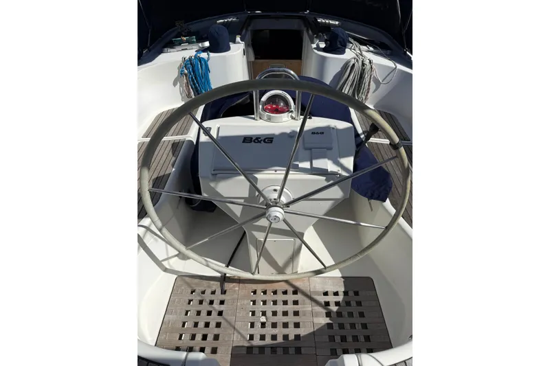 Slide: The Image of 1997 Beneteau Oceanis 461 yacht cockpit with steering wheel and navigation equipment. - 5