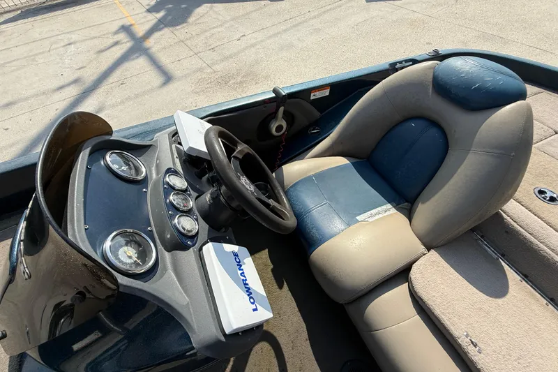 Slide: The Image of 2007 Ranger 188 VS boat cockpit with steering wheel and Lowrance device. - 11