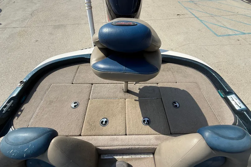 Slide: The Image of 2007 Ranger 188 VS boat interior with blue and beige seating and storage compartments. - 16