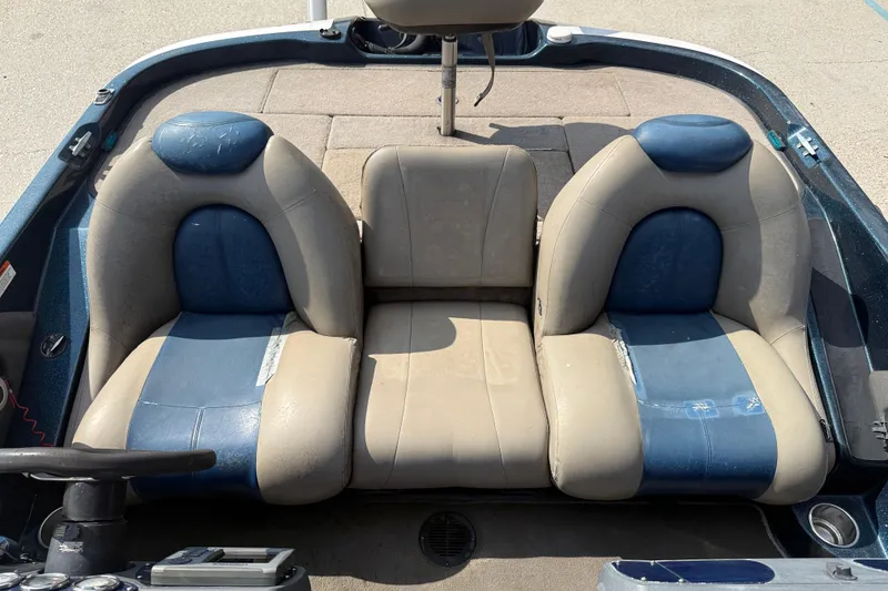 Slide: The Image of 2007 Ranger 188 VS boat interior with blue and beige seating. - 17