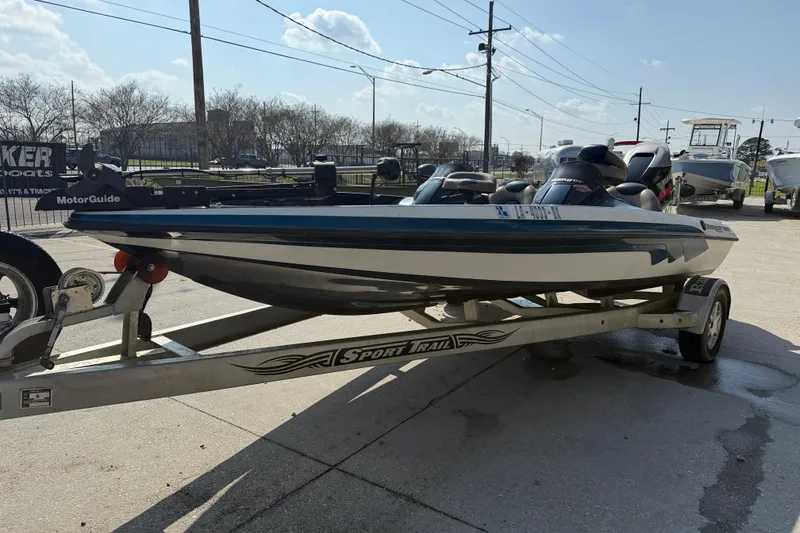 Slide: The Image of 2007 Ranger 188 VS boat on trailer, featuring MotorGuide equipment, parked outdoors. - 3