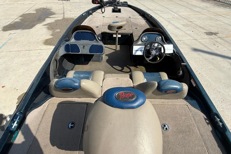 Slide: The Image of 2007 Ranger 188 VS boat interior with steering wheel and seating. - 7