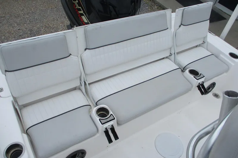Slide: The Image of 2020 Sea Fox 220 Viper boat seating with white cushions and cup holders. - 10