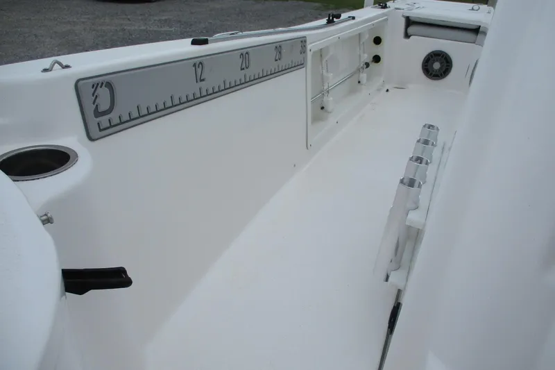 Slide: The Image of 2020 Sea Fox 220 Viper boat interior with rod holders and measurement scale. - 14