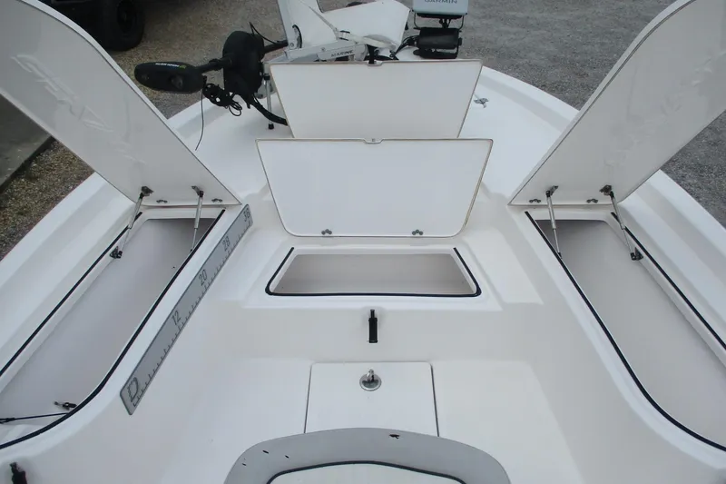 Slide: The Image of 2020 Sea Fox 220 Viper boat interior with open storage compartments and fishing equipment. - 6
