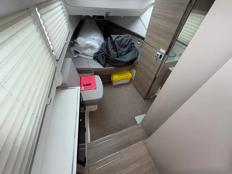 Slide: The Image of Interior of a 2027 Saxdor 320 GTO with modern wood paneling and cozy seating. - 27