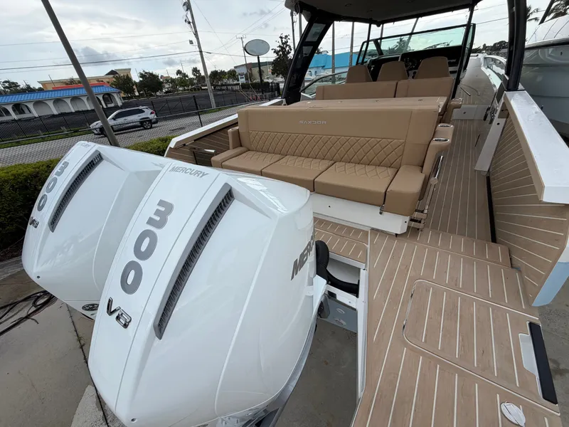 Slide: The Image of The image shows a 2027 Saxdor 320 GTO boat with twin Mercury 300 V8 engines. - 11