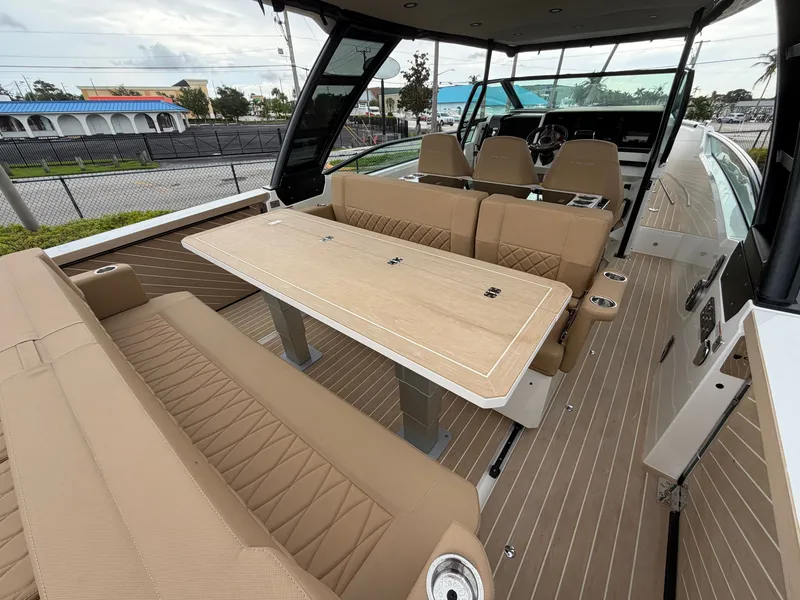 Slide: The Image of The image shows the interior of a 2027 Saxdor 320 GTO with elegant seating and a table. - 14