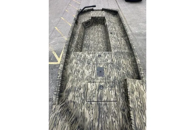 Slide: The Image of 2026 SeaArk 1752 Slayer X boat with camouflage pattern, viewed from above. - 4