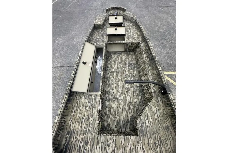 Slide: The Image of 2026 SeaArk 1752 Slayer X boat interior with camouflage design and storage compartments. - 5
