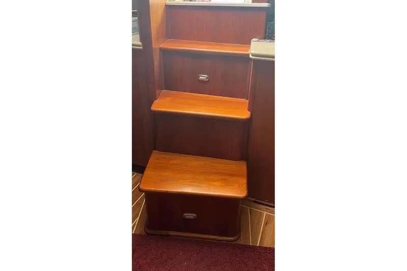 Slide: The Image of Wooden interior stairs on a 1999 Ocean Yachts 48 Express boat. - 21