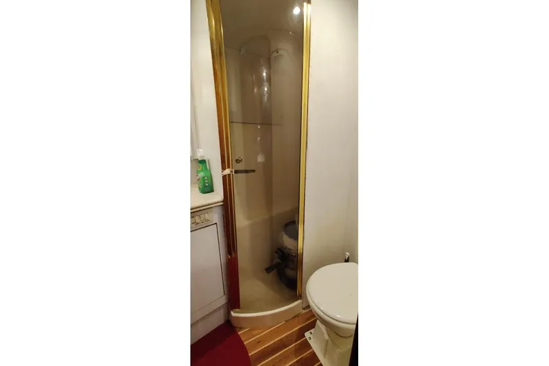 Slide: The Image of Bathroom interior of 1999 Ocean Yachts 48 Express, featuring shower and toilet. - 40
