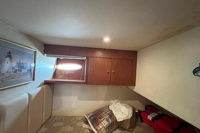 Slide: The Image of Interior of 1999 Ocean Yachts 48 Express with bed and cabinet. - 43